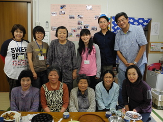Paul (standing right) with the Kasetsu caretaker (standing left) & residents